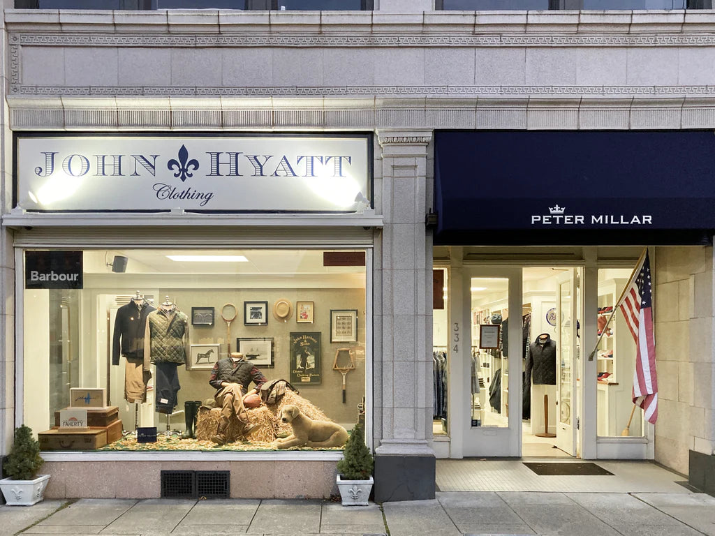 The John Hyatt Clothing storefront in Summit, NJ. featuring their decorated window and Peter Millar sign.